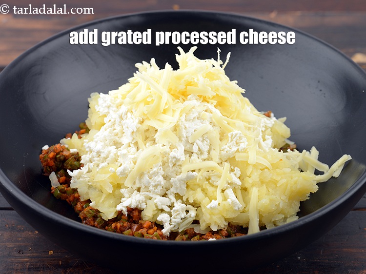 Step 20 – Add 1/4 cup&nbsp;<a href="https://www.tarladalal.com/glossary-grated-processed-cheese-868i">grated processed cheese</a>.