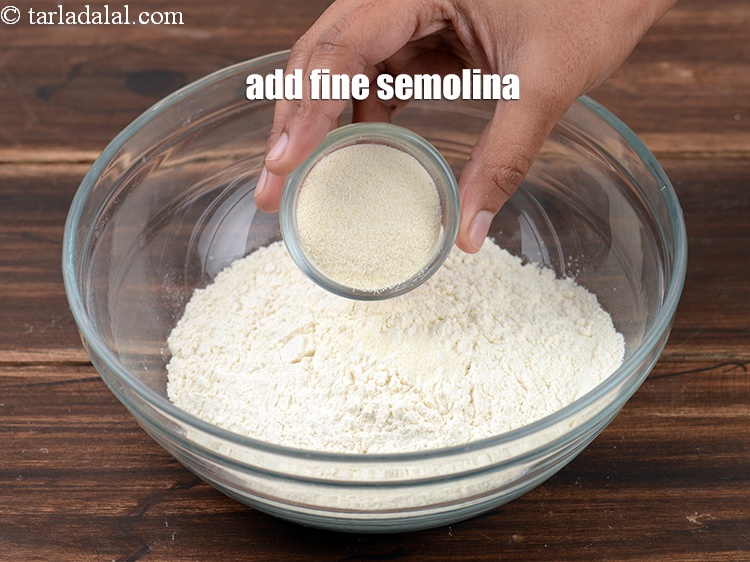 Step 22 – Add 2 tbsp fine <a href="https://www.tarladalal.com/glossary-semolina-sooji-rava-rawa-603i">semolina (rava / sooji)</a>.