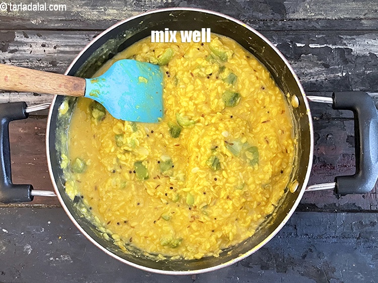 Step 29 – Mix <strong>turiya mag ni dal | turai moong dal | healthy ridge gourd curry |&nbsp;</strong>well.&nbsp;