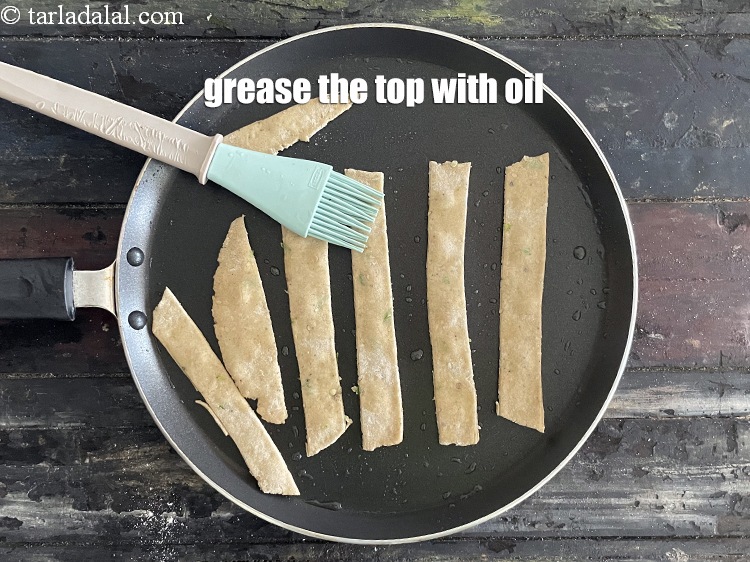 Step 21 – Grease the top with oil.