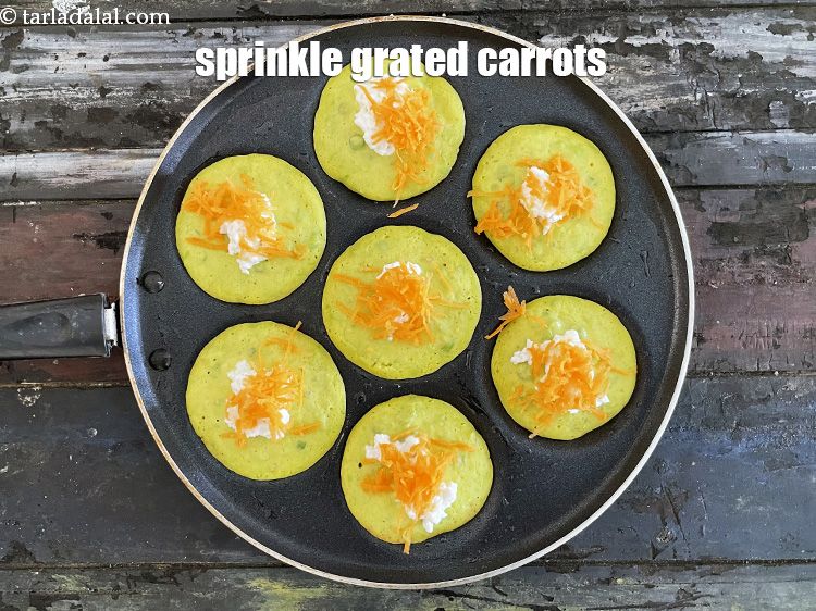 Step 20 – Sprinkle grated carrots over it.