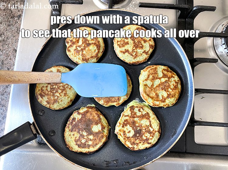 Step 32 – Press down with a spatula to see that the pancake cooks evenly.
