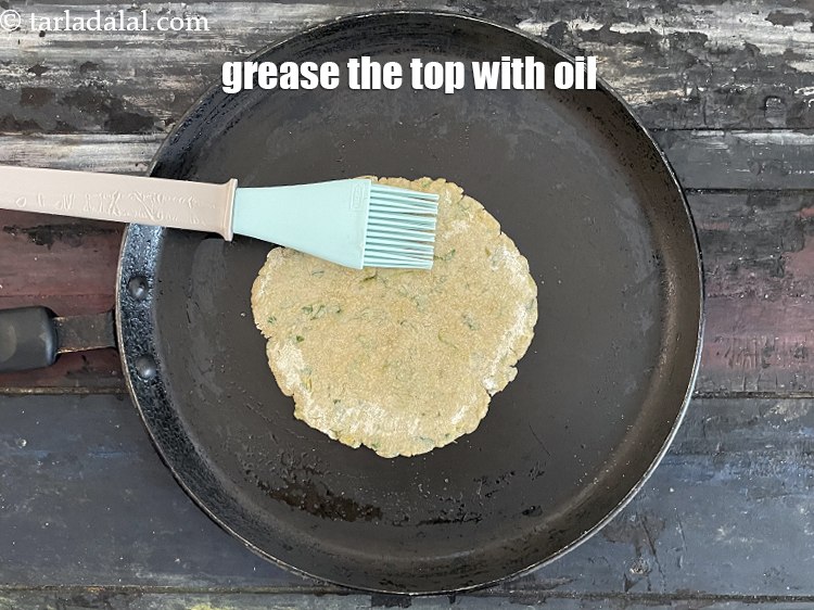 Step 22 – Grease the top of the paratha with oil.