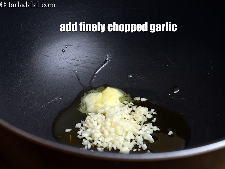 Step 22 – Add 2 tbsp finely <a href="https://www.tarladalal.com/glossary-chopped-garlic-790i">chopped garlic (lehsun)</a>.