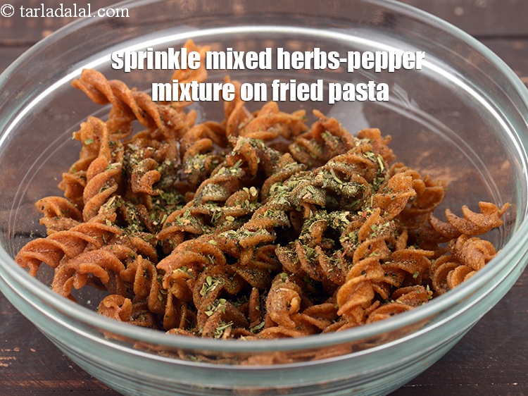 Step 20 – Sprinkle the mixed herbs-pepper mixture on the fried pasta.