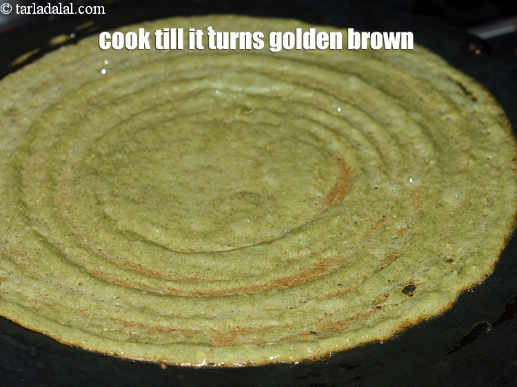 Step 20 – Cook on a medium flame, till the pesarattu turns golden brown in colour.