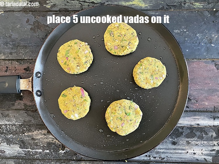 Step 26 – Place 5 uncooked vadas on it.