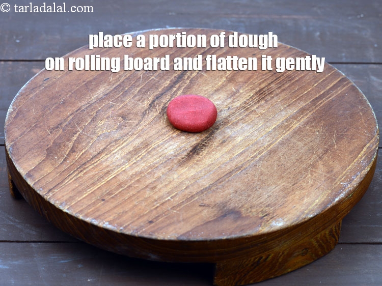 Step 19 – Place a portion of dough on rolling board and flatten it gently.
