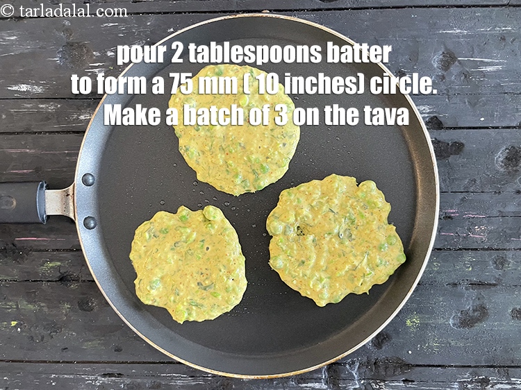 Step 20 – <p>Pour 2 tbsp of the batter on the tava&nbsp;and spread it lightly using a spoon …