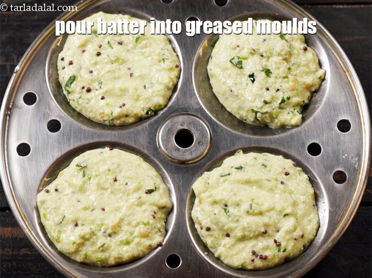 Step 21 – Pour equal quantities of batter into greased idli moulds.