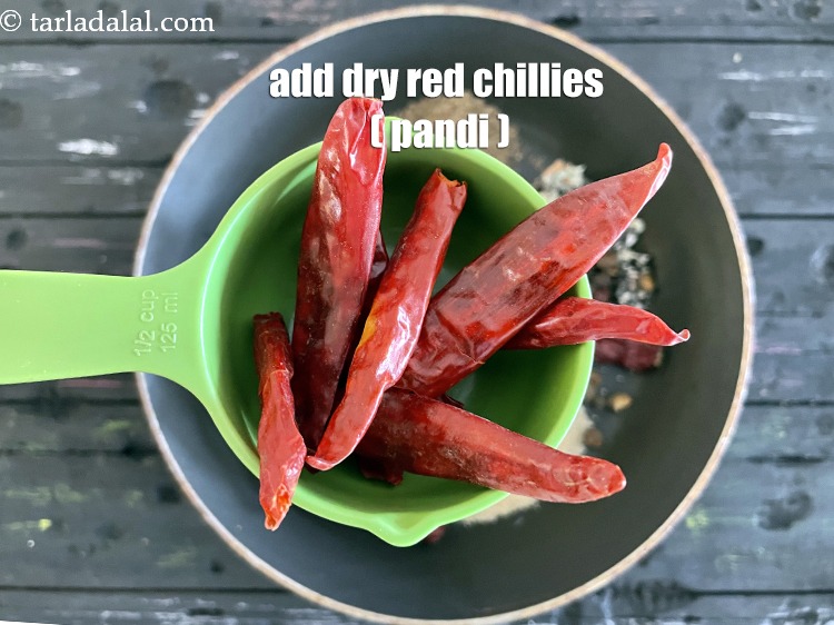Step 20 – Add&nbsp;<meta charset="UTF-8" />8&nbsp;<a href="glossary-pandi-chillies-pandi-dry-red-chillies-2373i">dry red chillies (pandi)</a>&nbsp;, broken into pieces.