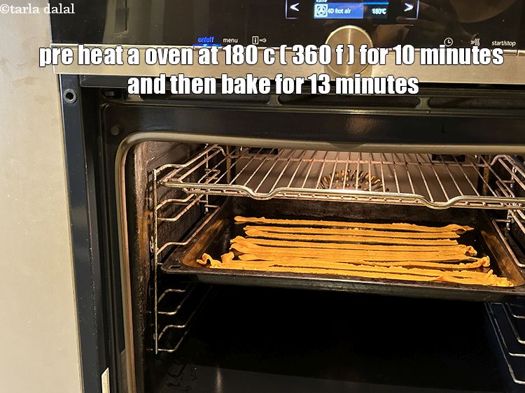 Step 20 – <html><head><meta charset="UTF-8"> </head><body><p>Pre heat a oven for 10 minutes and bake masala sev&nbsp;at 180°c (360°f) …