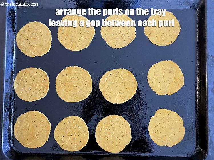 Step 21 – Arrange the puris on the baking tray leaving a gap between each puri.