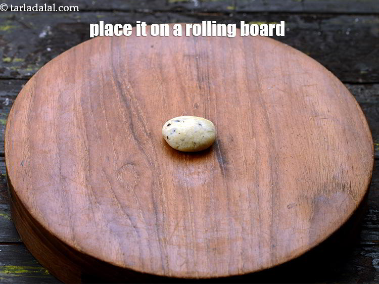 Step 22 – Place it on a rolling board and flatten it with a palm.