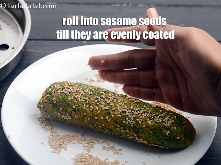 Step 20 – Roll the rolls into sesame seeds till they are evenly coated from all the sides.&nbsp;