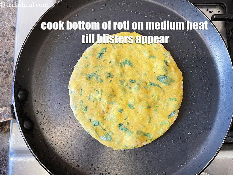 Step 21 – Cook the bottom of the roti for 30 upto seconds on medium heat till blisters …