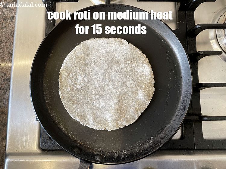 Step 23 – Cook the roti on medium flame for about 15 seconds or&nbsp;until a small bubble appears.