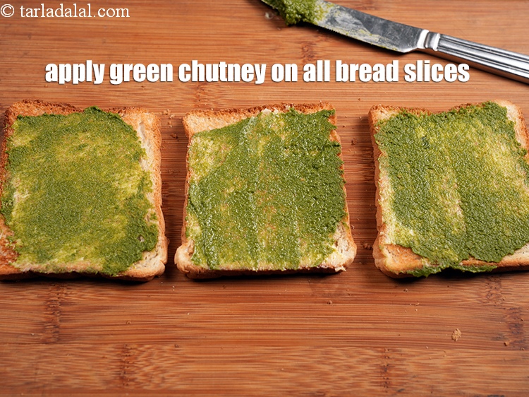 Step 22 – Apply &frac12; tsp of <a href="https://www.tarladalal.com/green-chutney-22266r">green chutney</a> on all 3 bread slices.