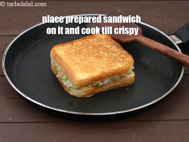 Step 20 – Place the prepared sandwich on it with the buttered side facing upwards and cook on …