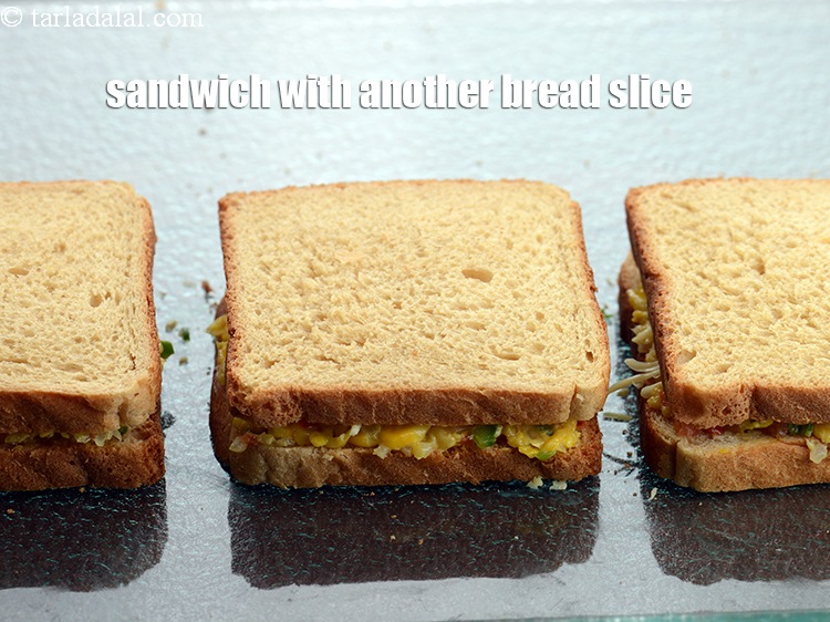 Step 20 – Sandwich it with another bread slice with the buttered side facing downwards.