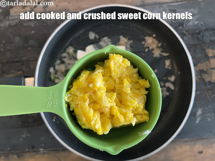 Step 33 – Add&nbsp;<meta charset="UTF-8" />1/2 cup&nbsp;<a href="glossary-boiled-and-crushed-sweet-corn-kernels-1930i">cooked and crushed sweet corn kernels</a>&nbsp;(makai ke dane).