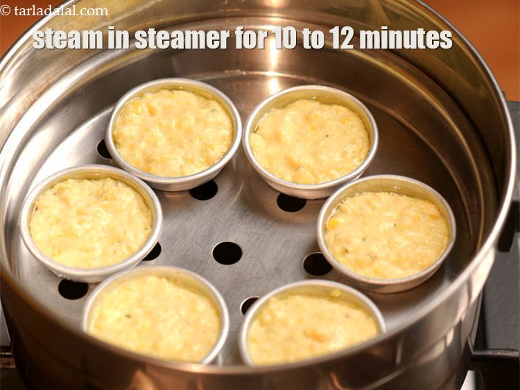 Step 20 – Steam in a steamer for 10 to 12 minutes or till the dhoklas are cooked.