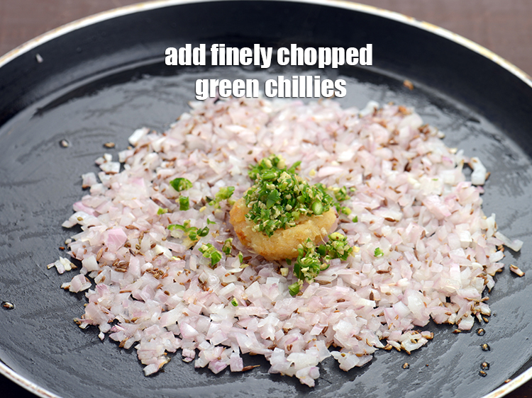 Step 20 – Add 1 tsp finely&nbsp;<a href="https://tarladalal.com/glossary-chopped-green-chilli-820i">chopped green chillies</a>.