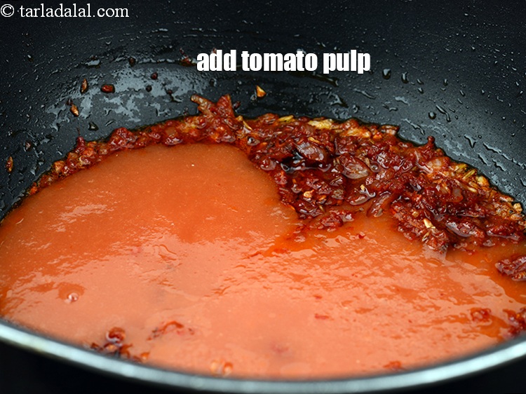 Step 21 – Add 1 cup <a href="https://www.tarladalal.com/glossary-tomato-pulp-tamatar-ka-pulp-1039i">tomato pulp</a>.
