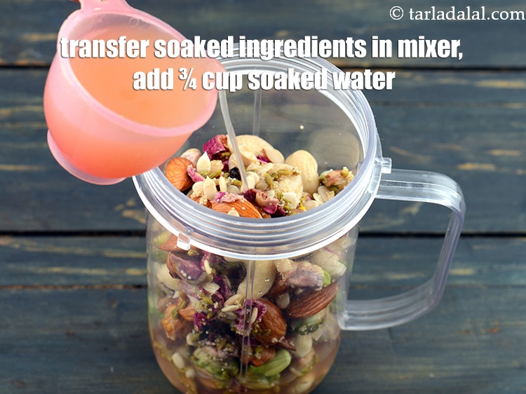 Step 21 – Transfer the soaked ingredients in a mixer jar, add &frac34; cup of soaked water.&nbsp;