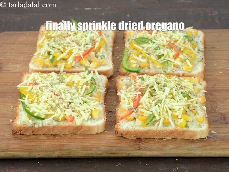 Step 20 – Finally sprinkle &frac14; tsp <a href="https://www.tarladalal.com/glossary-dried-oregano-268i">dried oregano</a>.