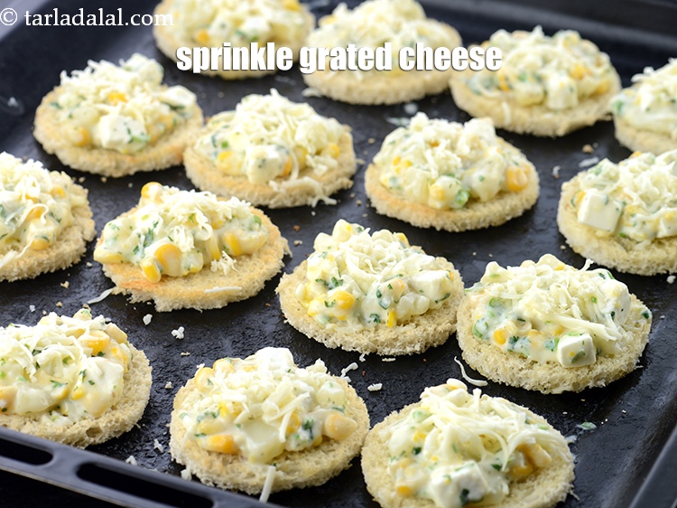 Step 20 – Sprinkle &frac12; tsp of <a href="https://www.tarladalal.com/glossary-grated-processed-cheese-868i">grated processed cheese</a> on top.