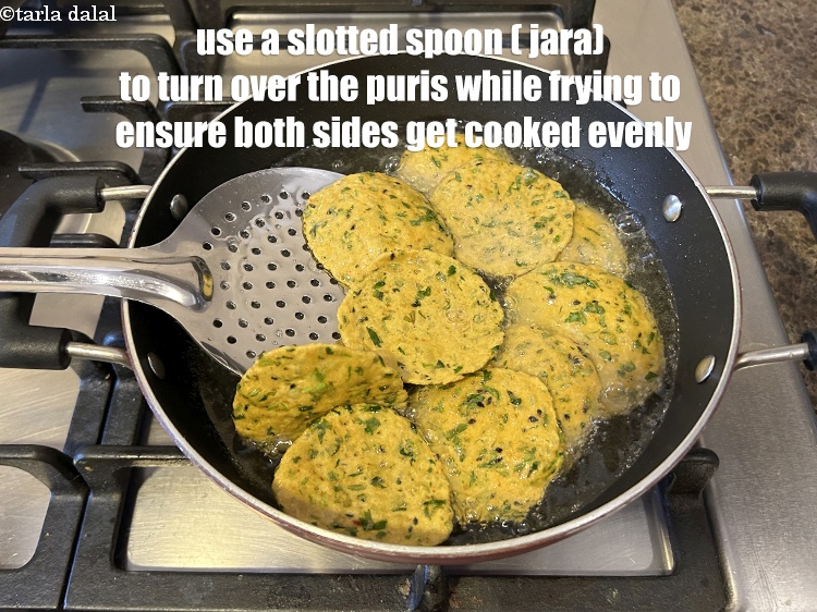 Step 20 – Use a slotted spoon ( jara) to keep turning over the soya puris to ensure …