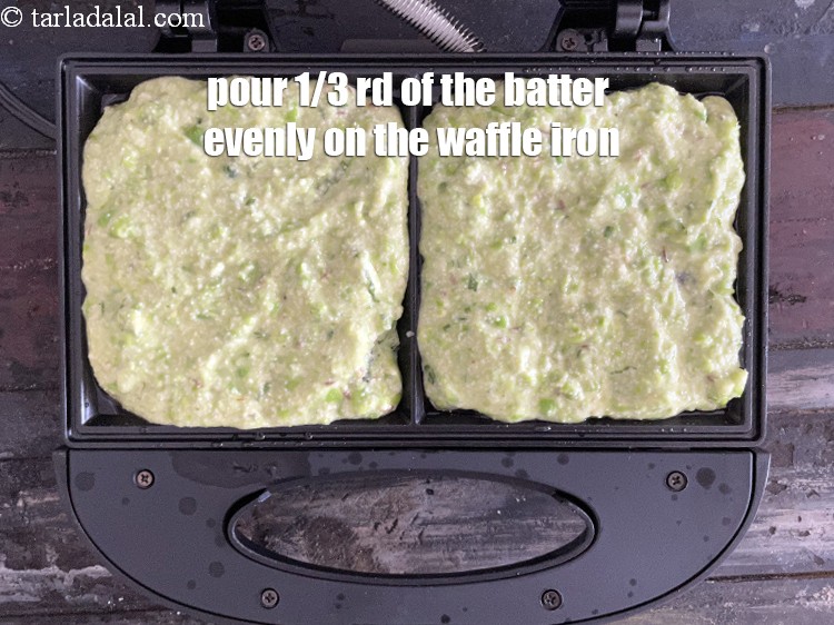 Step 22 – Use 1/3 of the green pea batter to spread it evenly into 2 waffle moulds.