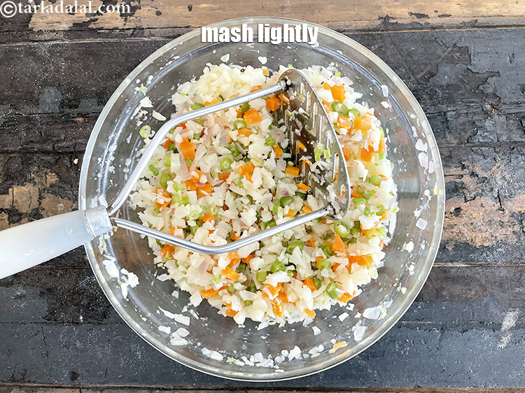 Step 22 – Mash lightly using a potato masher.