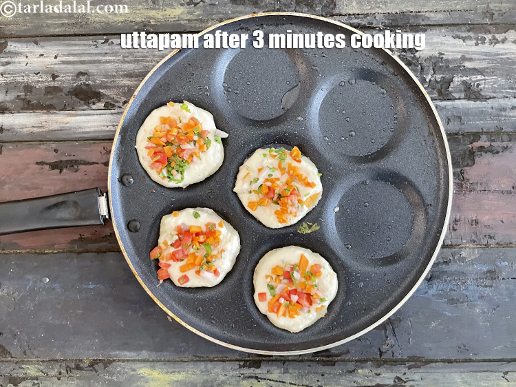 Step 32 – This is how the semolina uttapam looks like after 3 minutes.