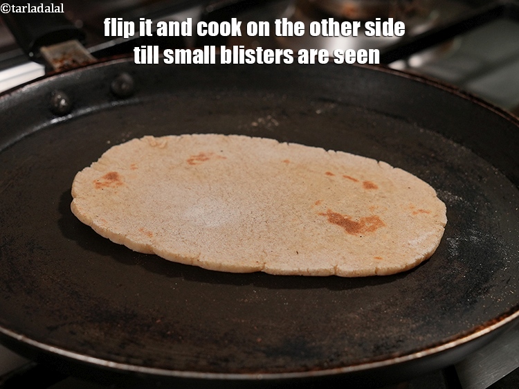 Step 21 – Flip it and cook on the other side till small blisters are seen.