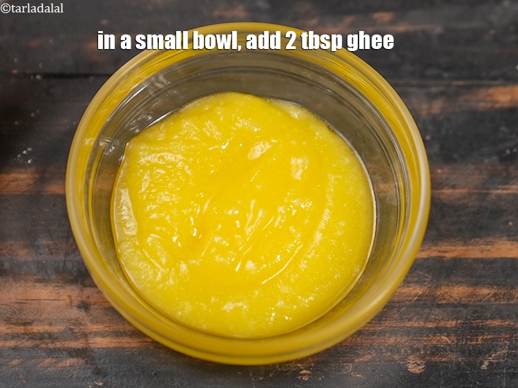 Step 21 – In a small bowl, add 2 tbsp <a href="https://www.tarladalal.com/glossary-ghee-245i">ghee</a>.