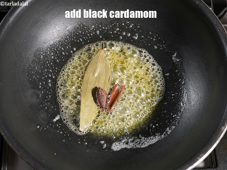 Step 22 – Add 1 <a href="https://www.tarladalal.com/glossary-black-cardamom-badi-elaichi-moti-elaichi-263i">black cardamom (badi elaichi)</a>.