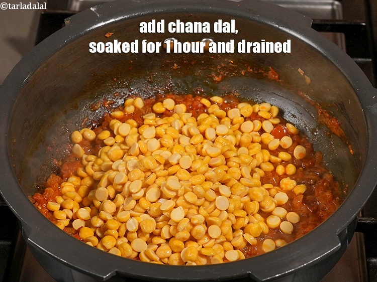 Step 22 – Add &frac34; cup <a href="https://www.tarladalal.com/glossary-chana-dal-split-bengal-gram-285i">chana dal (split bengal gram)</a>&nbsp;, soaked for 1 hour and drained.