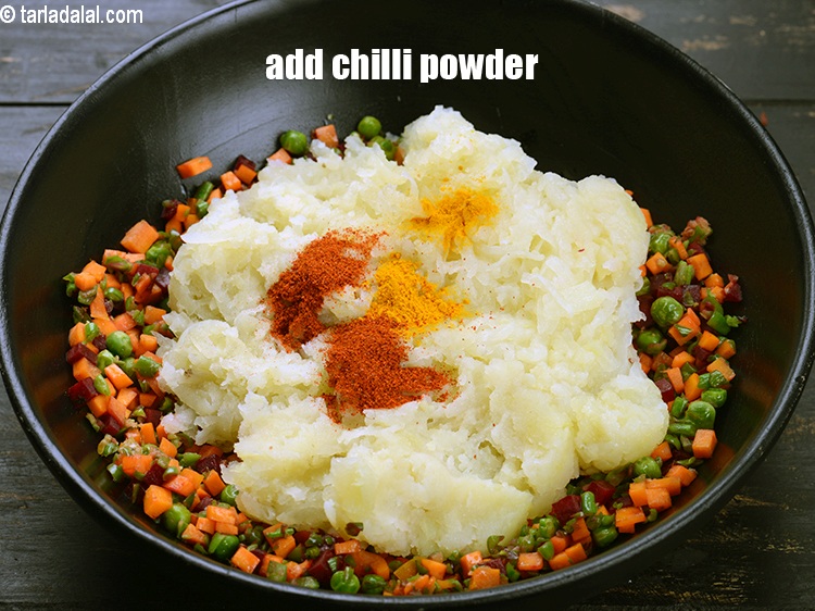 Step 22 – Add &frac12; tsp <a href="https://www.tarladalal.com/glossary-chilli-powder-red-chilli-powder-339i">chilli powder</a>.
