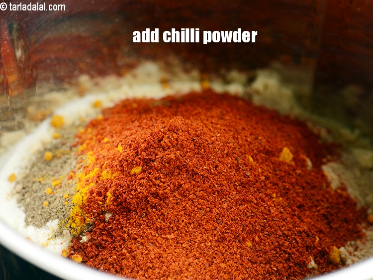 Step 21 – Add 2 tsp <a href="https://www.tarladalal.com/glossary-chilli-powder-red-chilli-powder-339i">chilli powder</a>.