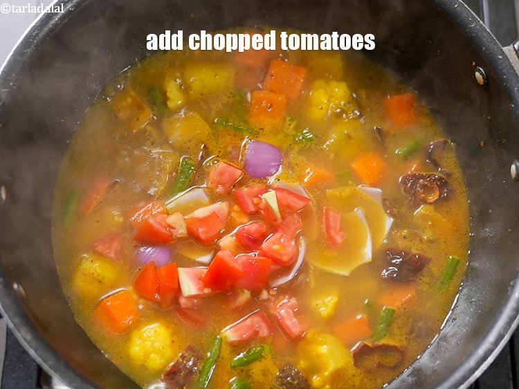 Step 21 – Add &frac14; cup <a href="https://www.tarladalal.com/glossary-chopped-tomatoes-779i">chopped tomatoes</a>.&nbsp;
