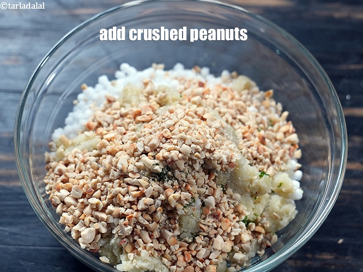 Step 21 – Add 1/2 cup <a href="https://www.tarladalal.com/glossary-roasted-and-crushed-peanuts-1817i">roasted and coarsely crushed peanuts</a>.