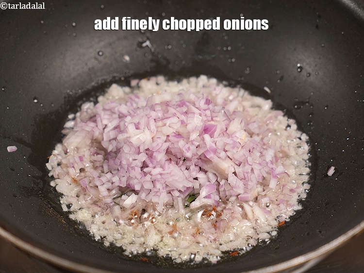 Step 21 – Add &frac12; cup finely&nbsp;<a href="https://www.tarladalal.com/glossary-chopped-onions-722i">chopped onions</a>.