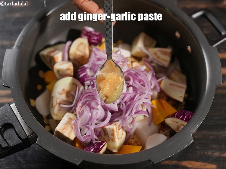 Step 21 – Add 1 tsp <a href="https://www.tarladalal.com/glossary-ginger-garlic-paste-adrak-lehsun-ki-pate-adrak-lahsun-ki-paste-939i">ginger-garlic (adrak-lehsun) paste</a>.&nbsp;