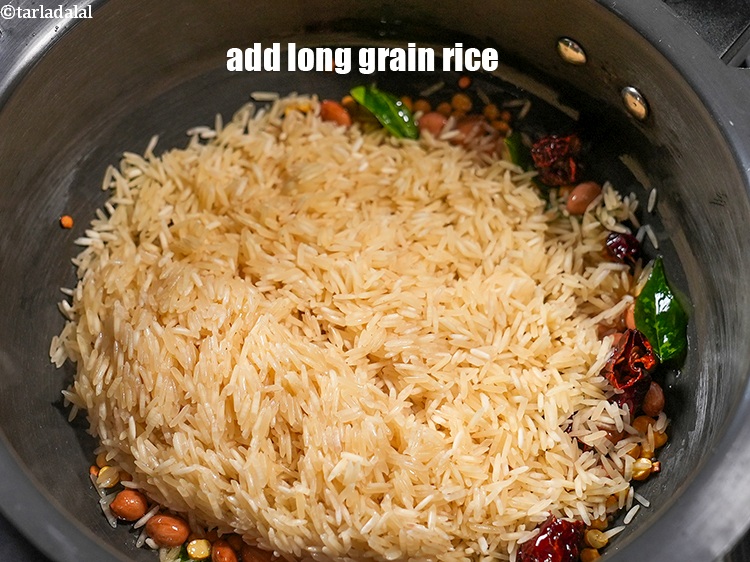 Step 21 – Add 1&frac14; cups <a href="https://www.tarladalal.com/glossary-long-grain-rice-basmati-chawal-basmati-rice-535i">long grain rice (basmati chawal)</a>&nbsp;.