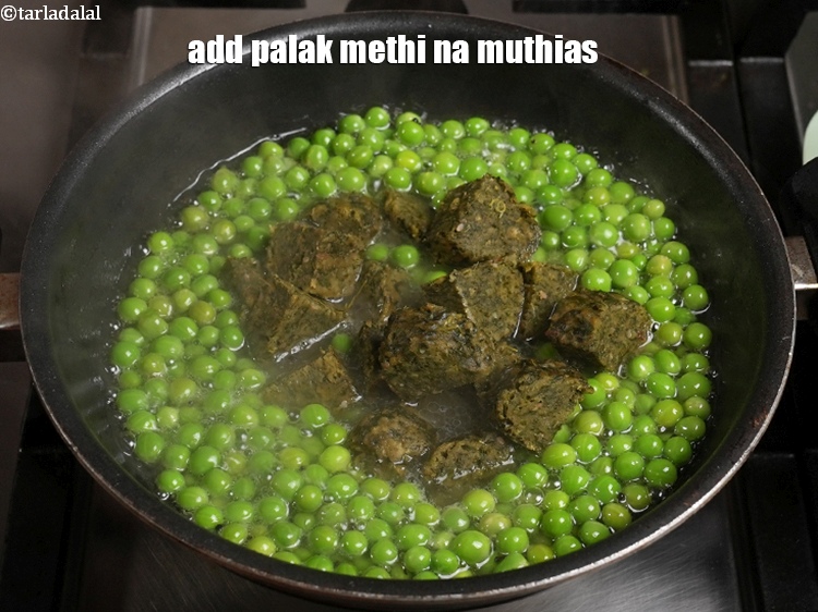Step 22 – Just before serving, add the prepared palak methi na muthias to the green peas.