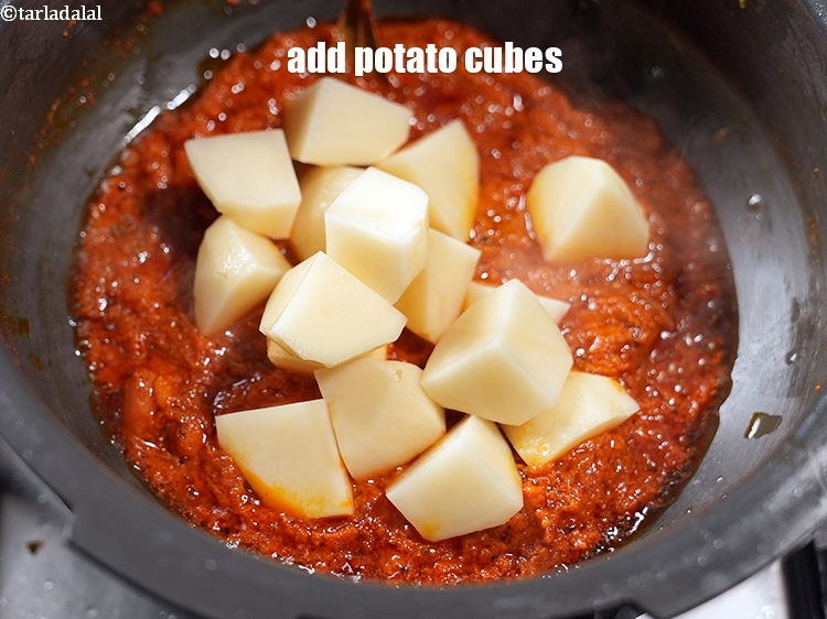 Step 21 – Add 1 cup&nbsp;<a href="https://www.tarladalal.com/glossary-potato-cubes-725i">potato cubes</a>.