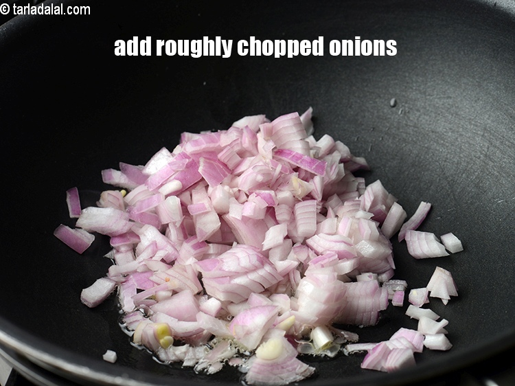 Step 22 – Add &frac12; cup roughly&nbsp;<a href="https://www.tarladalal.com/glossary-chopped-onions-722i">chopped onions</a>.
