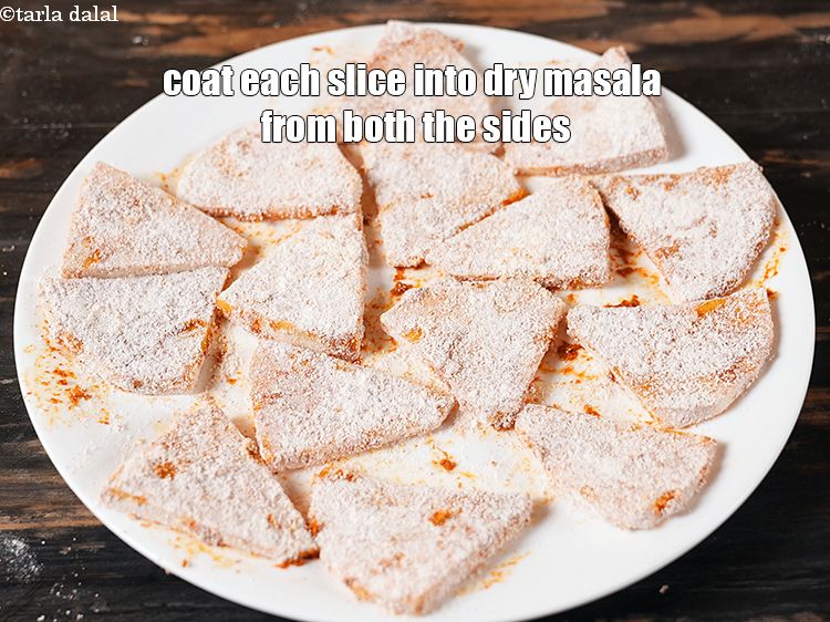 Step 21 – Then coat each slice into dry masala from both the sides.&nbsp;